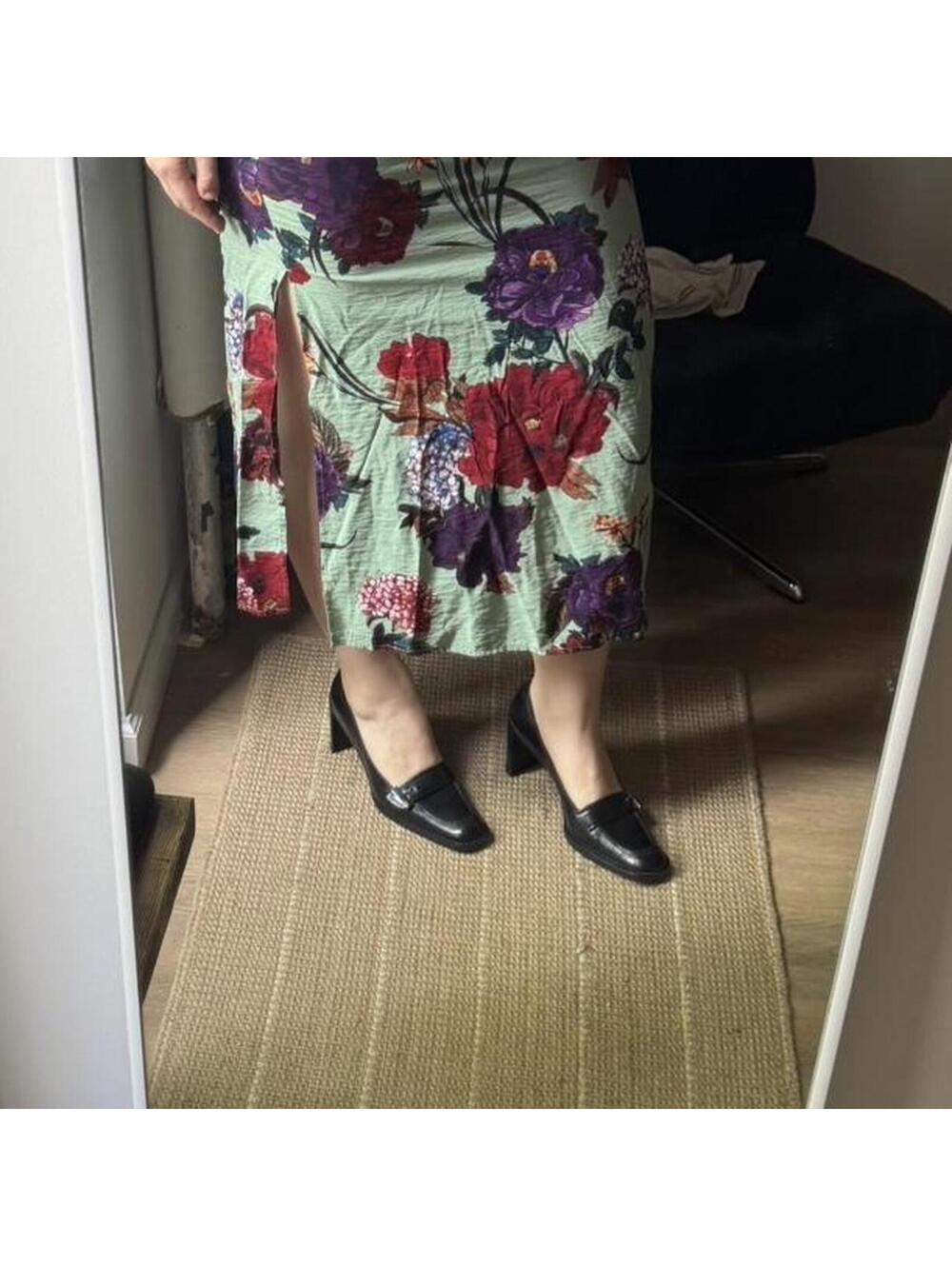 Vintage Gucci black leather loafer heels with silver buckle